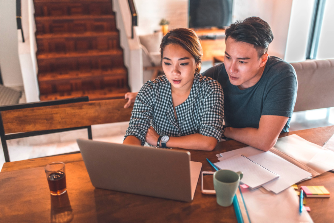Couple looking at laptop