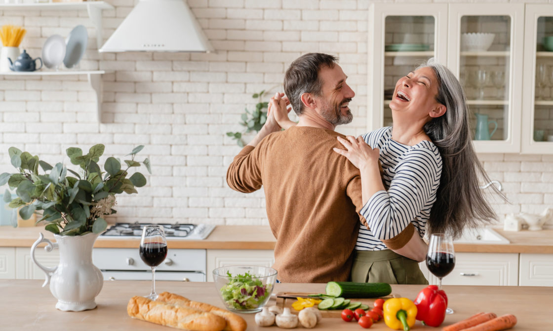 Couple dancing in kitchen