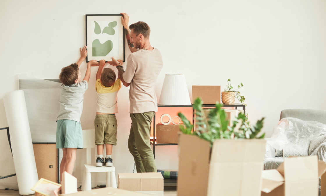 Family hanging up photo